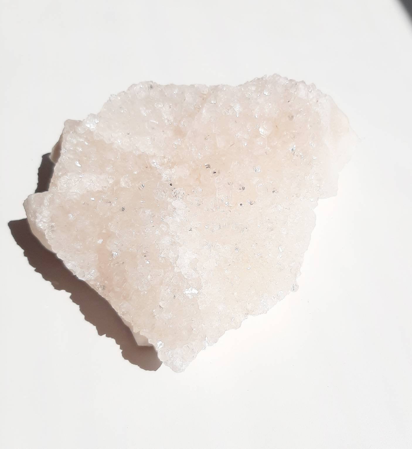 Medium size glittery pink apophyllite crystal
