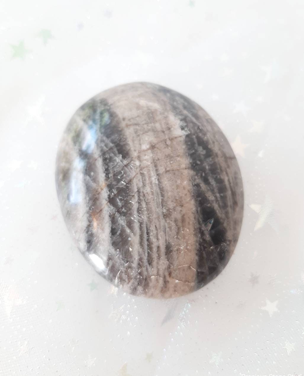 Black moonstone palm stone