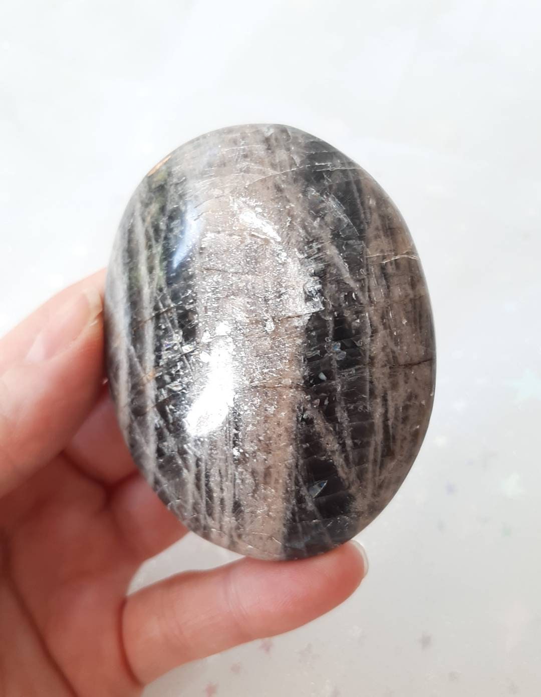 Black moonstone palm stone