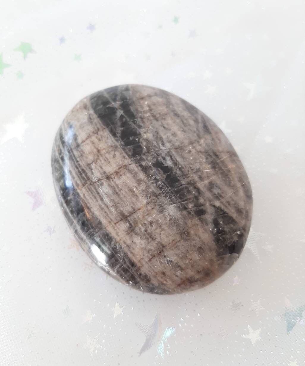 Black moonstone palm stone