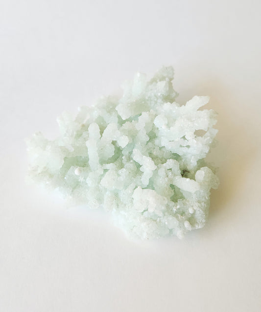 Mint green prehnite with okenite cotton balls