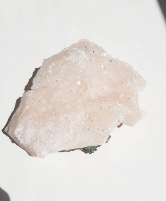 Medium size glittery pink apophyllite crystal