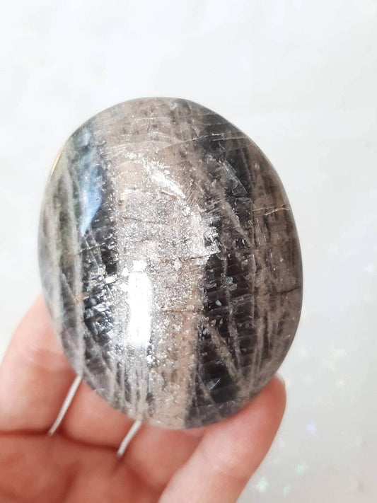 Black moonstone palm stone